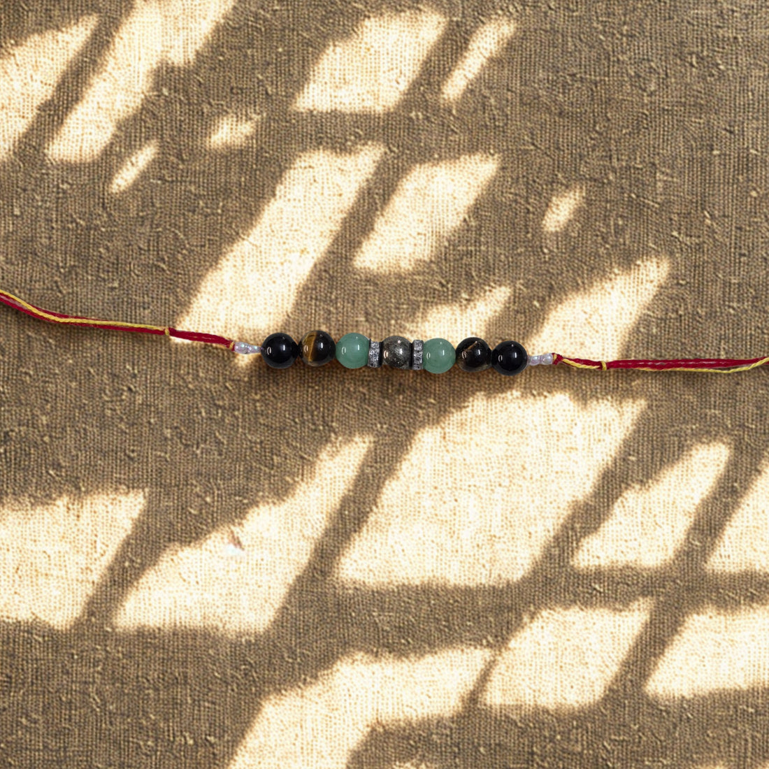 7 Beads Crystal Rakhi – Pyrite, Aventurine, Tiger Eye & Tourmaline