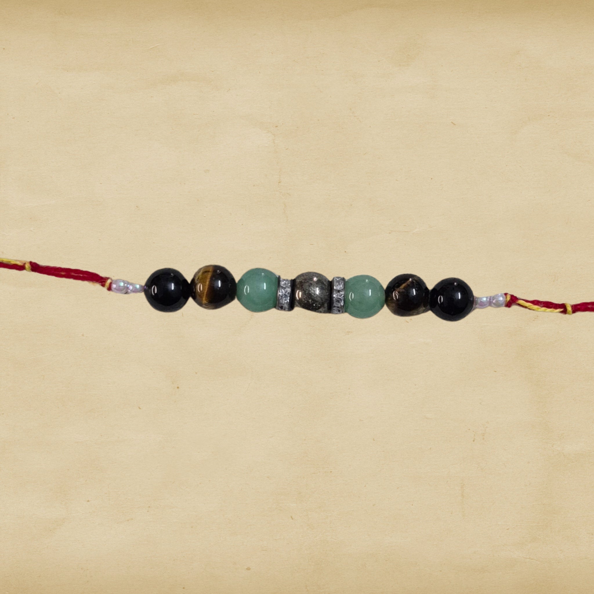 7 Beads Crystal Rakhi – Pyrite, Aventurine, Tiger Eye & Tourmaline