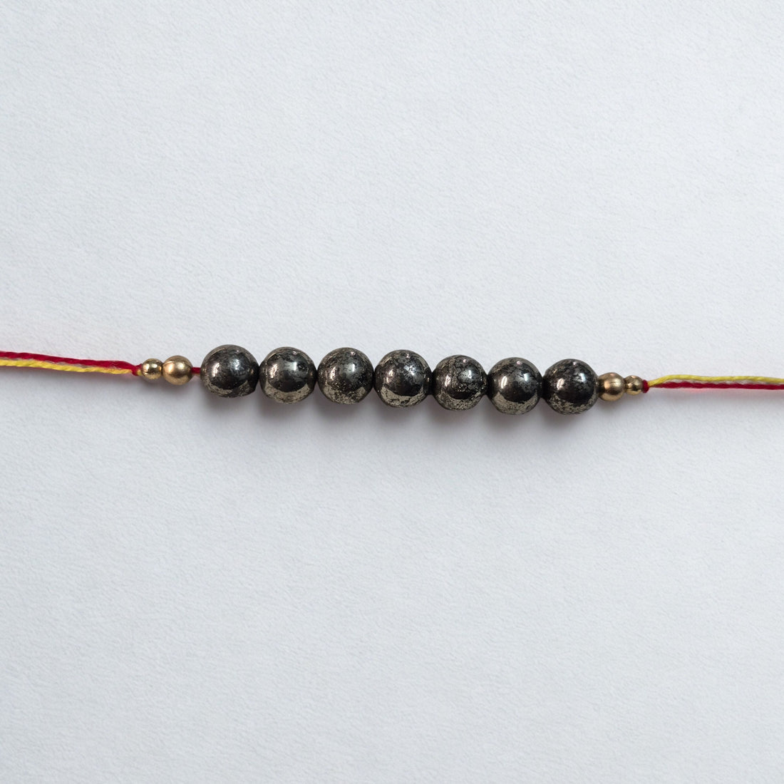 7 Beads Pyrite Rakhi – Attract Prosperity & Protection